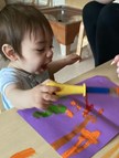 Babies making marks with paint